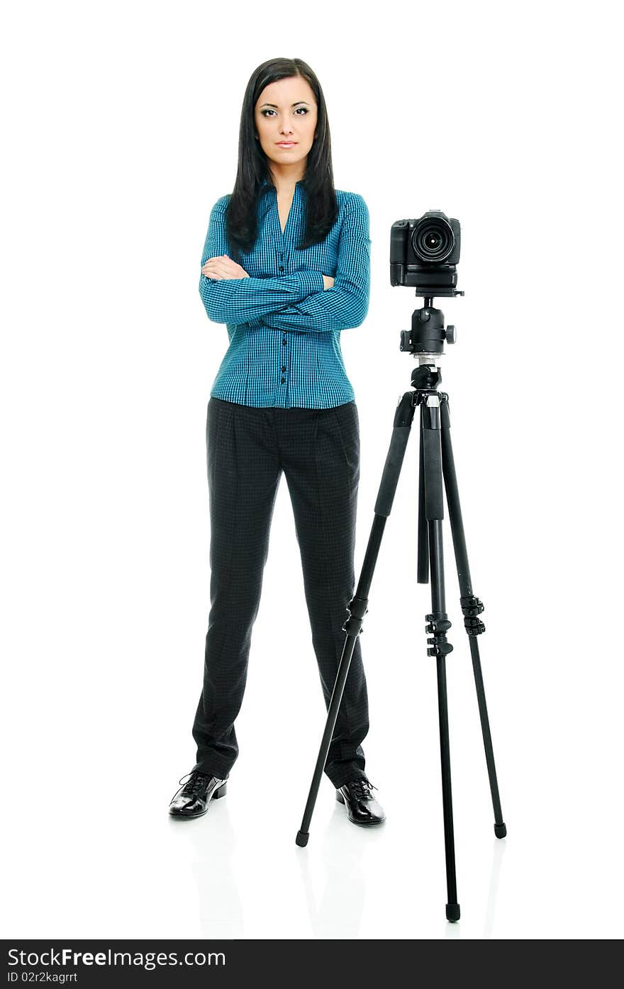 Portrait of beauty brunette with tripod and camera on white. Portrait of beauty brunette with tripod and camera on white