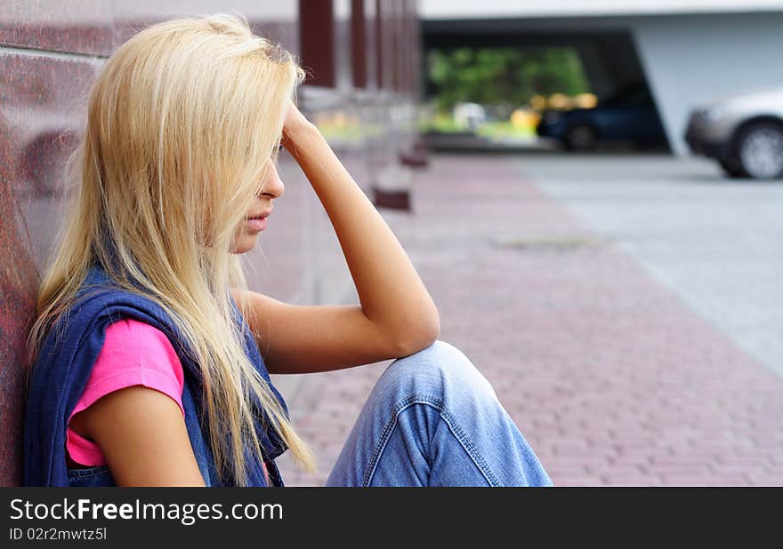 Portrait of the young woman in the street. Portrait of the young woman in the street