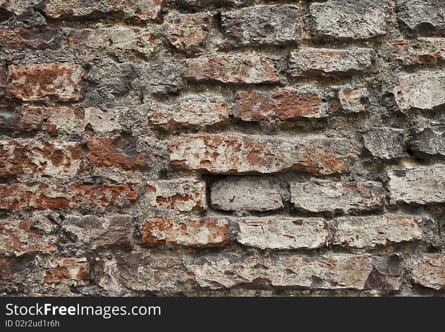 Worn, almost broken brick wall