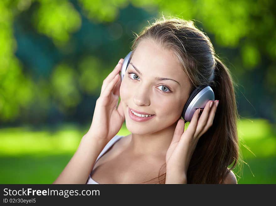 Portrait of a young girl listening to music with headphones. Portrait of a young girl listening to music with headphones