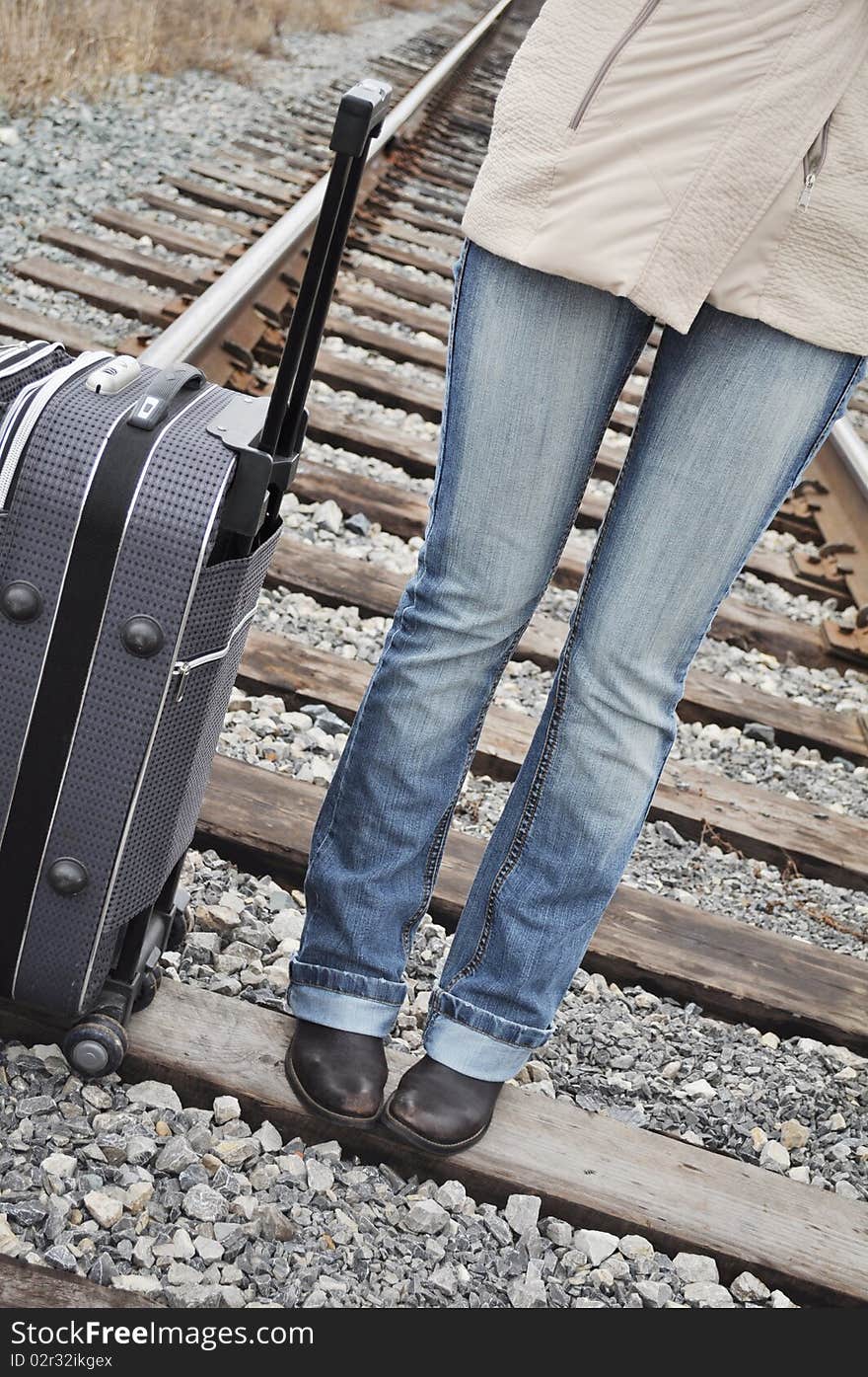 At the railway sleepers can see his feet tourist and his. At the railway sleepers can see his feet tourist and his