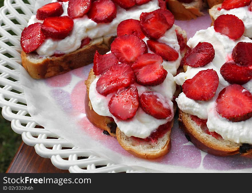 Delicious pastries with fresh strawberries and whipped cream. Delicious pastries with fresh strawberries and whipped cream