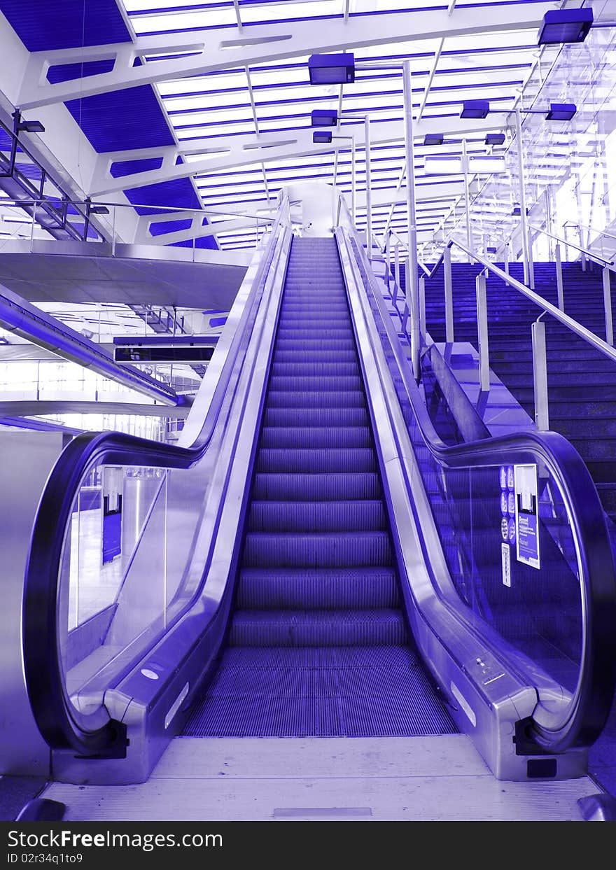 Detail of subway stairs in blue colored filter