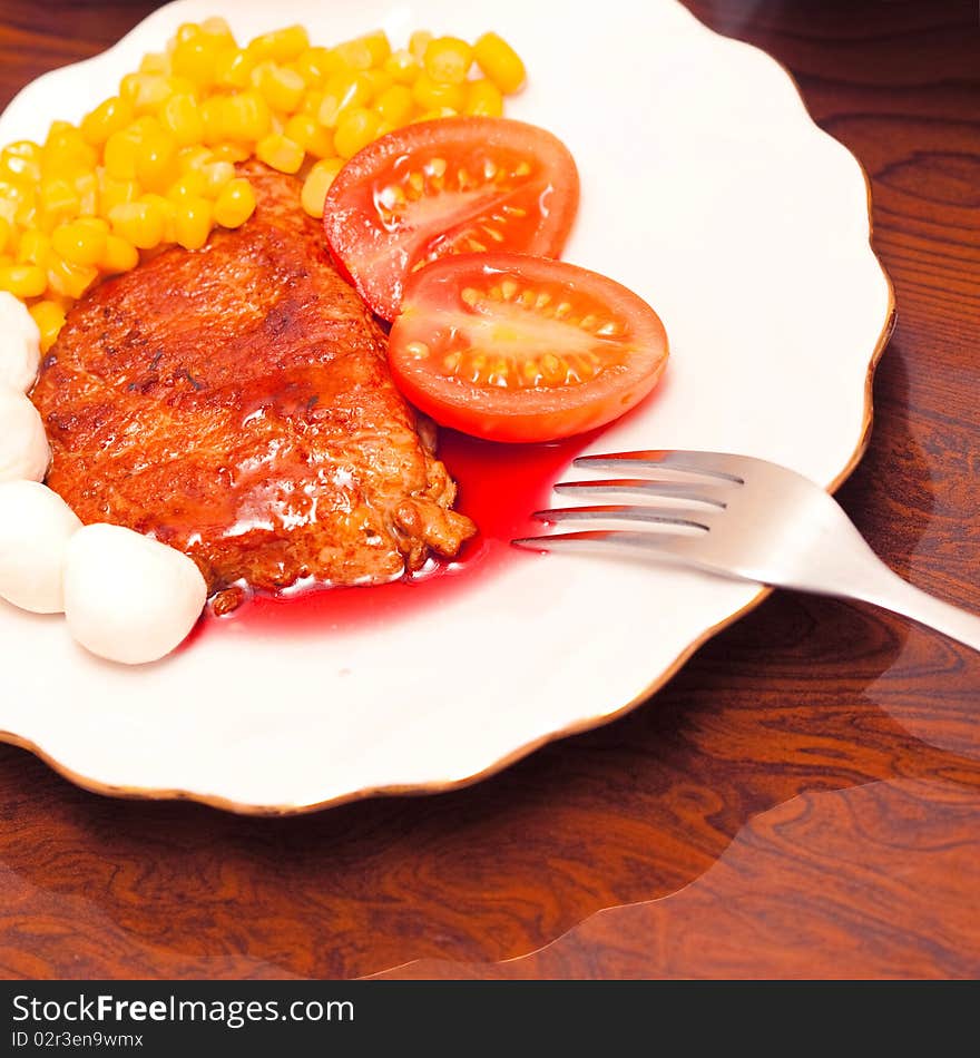 Dish with fried meat and sauce. Dish with fried meat and sauce