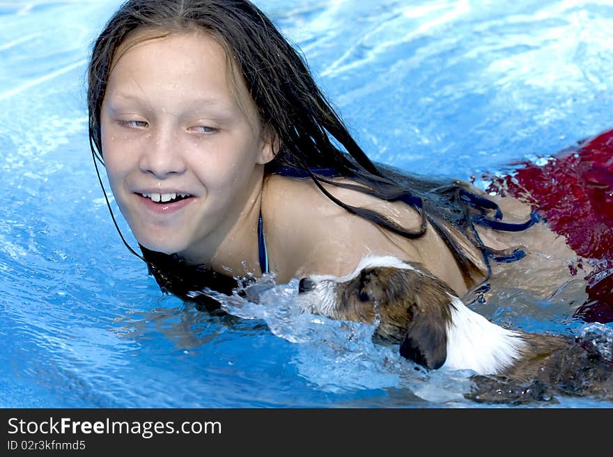 Girl swimming with her dog