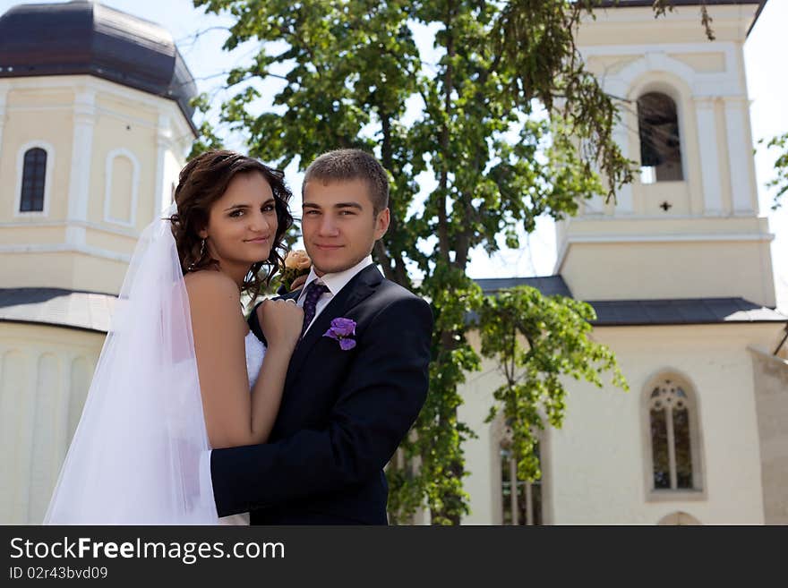 Bride and groom posing and smiling. Bride and groom posing and smiling