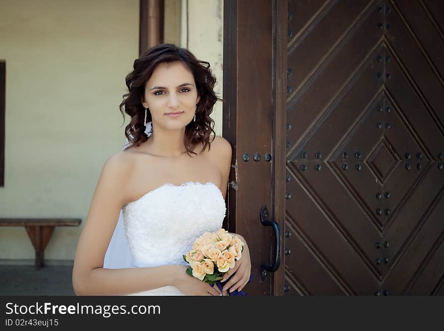 Young woman posing in white dress