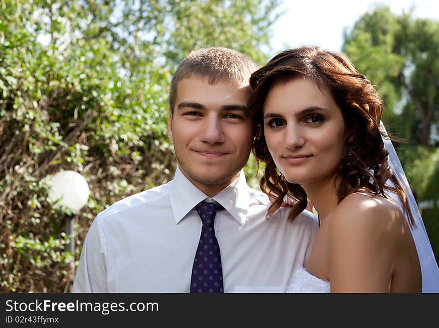 Bride and groom posing and smiling. Bride and groom posing and smiling