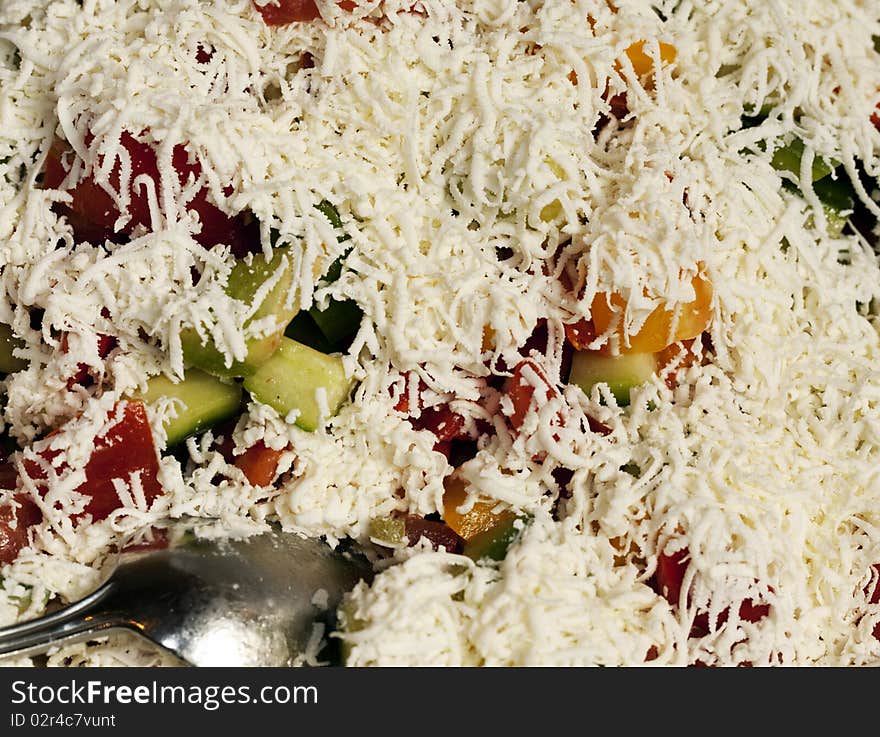 Greek Salad with colorful vegetables and Shredded Feta Cheese Full Frame. Greek Salad with colorful vegetables and Shredded Feta Cheese Full Frame