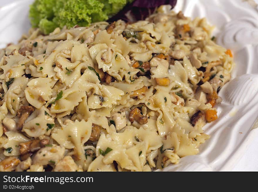 Pasta - Farfalle  with Chanterelle Herb and Olive Oil on Plate Full Frame. Pasta - Farfalle  with Chanterelle Herb and Olive Oil on Plate Full Frame