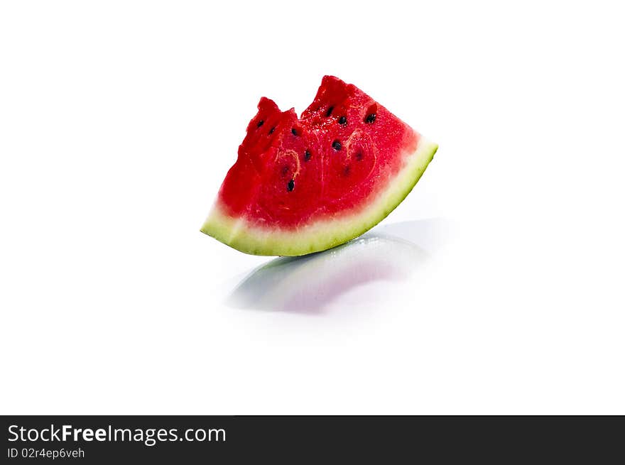 Little fresh juicy slice of watermelon isolated on white background. Little fresh juicy slice of watermelon isolated on white background