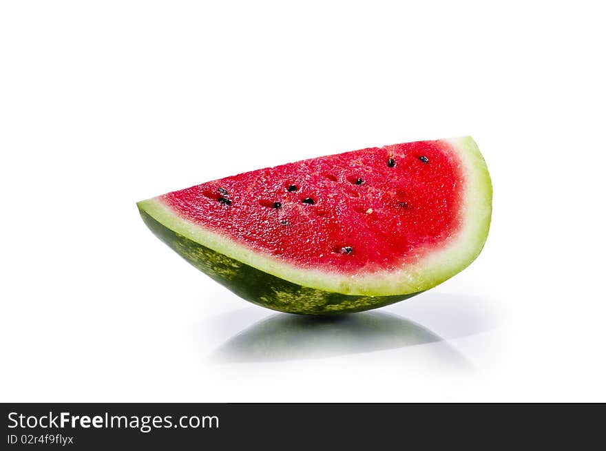 Slice of fresh juisy watermelon isolated on white background with reflection