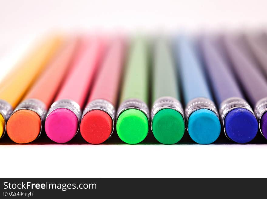 A Row of Colourful Erasers on the ends of pencils