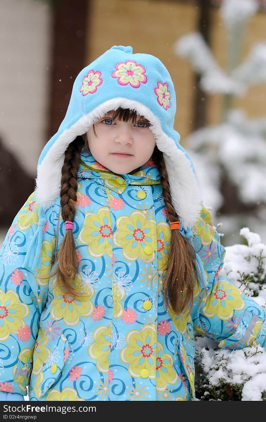 Winter Toddler Girl In Warm  Hat In Forest