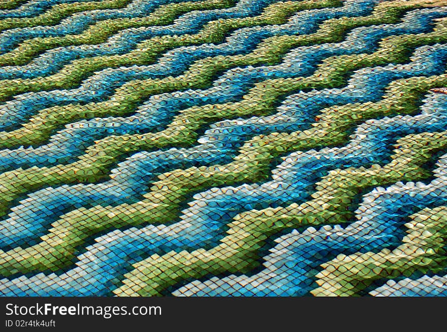 Underwater mosaic in the garden waterfall