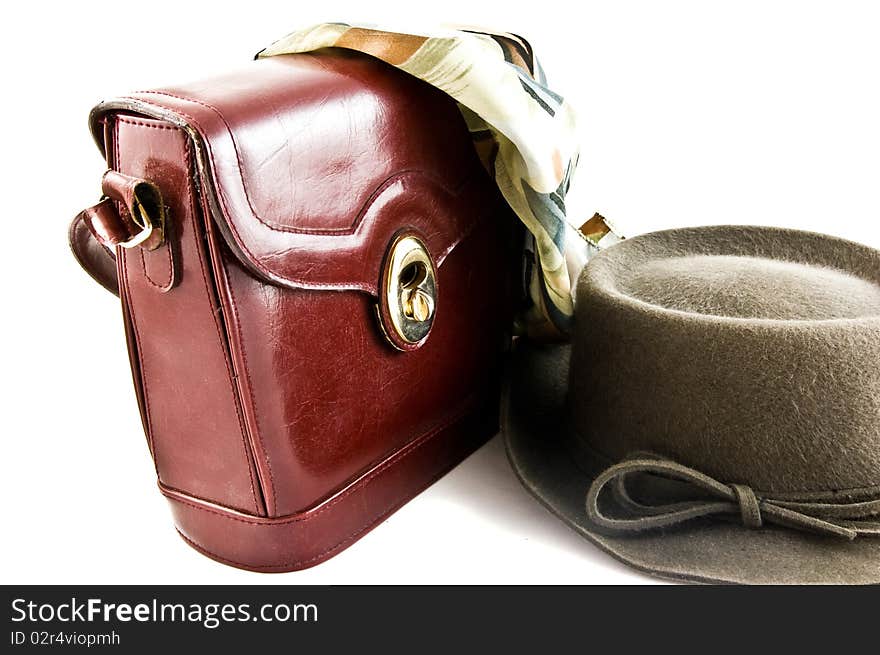 Old gray autumn hat and brown bag on white background isolated. Old gray autumn hat and brown bag on white background isolated