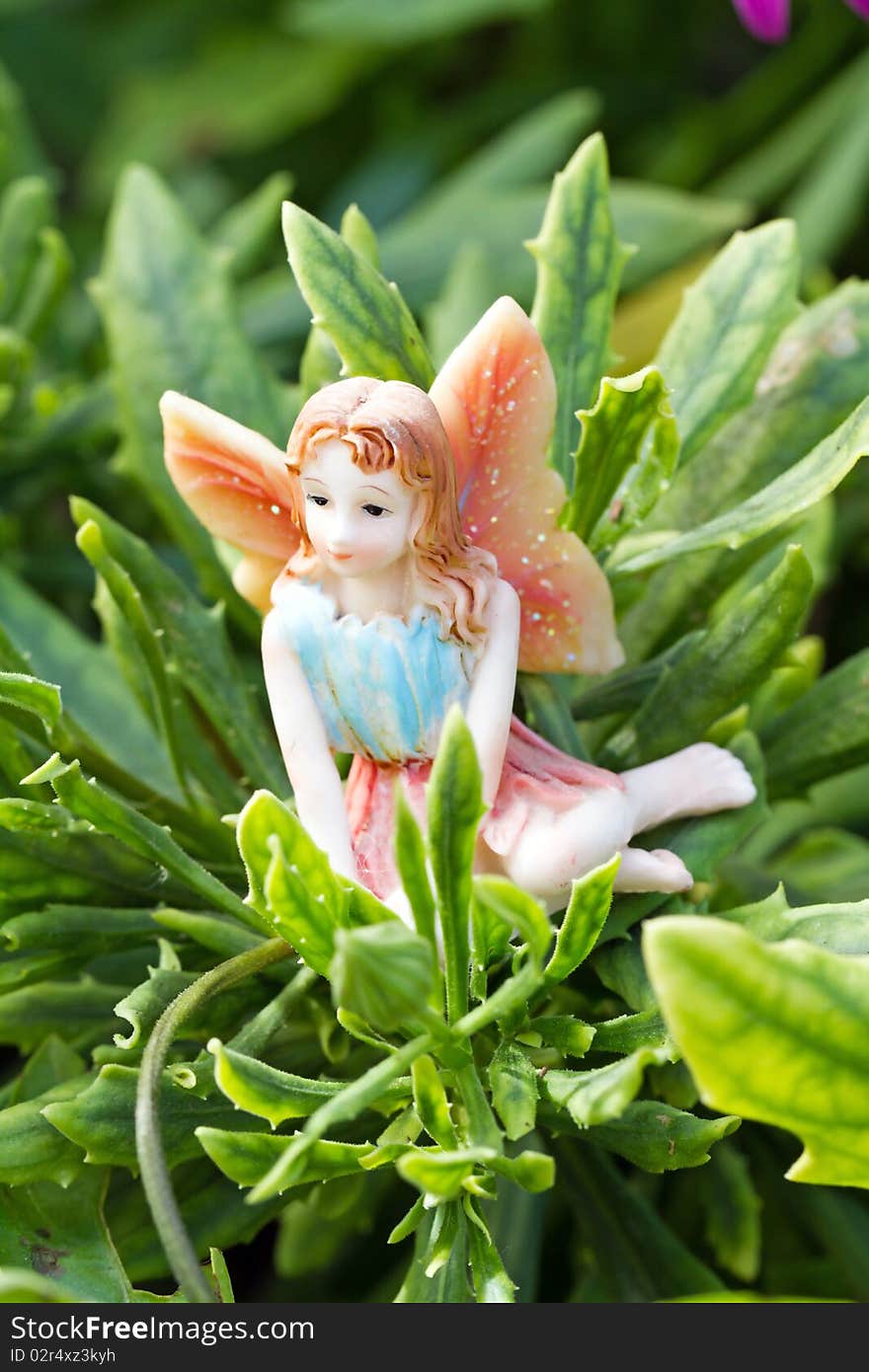 Generic doll form of fairy on vegetation