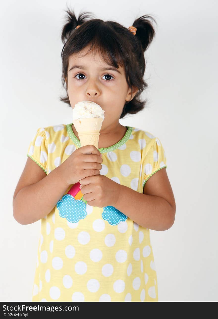 Sweet and cute toddler eating and enjoying ice cream. Sweet and cute toddler eating and enjoying ice cream