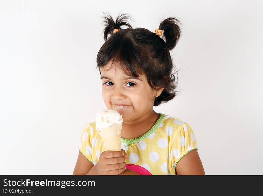 Sweet and cute toddler eating and enjoying ice cream. Sweet and cute toddler eating and enjoying ice cream