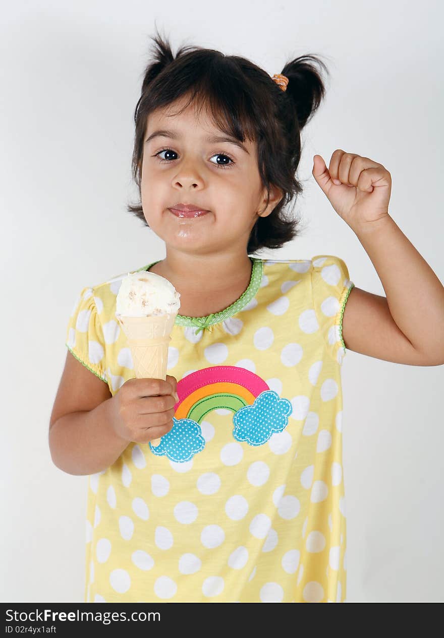 Sweet and cute toddler eating and enjoying ice cream. Sweet and cute toddler eating and enjoying ice cream