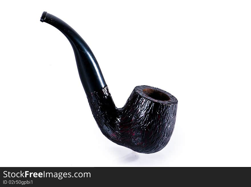 Old black stylish tobacco pipe isolated on white background