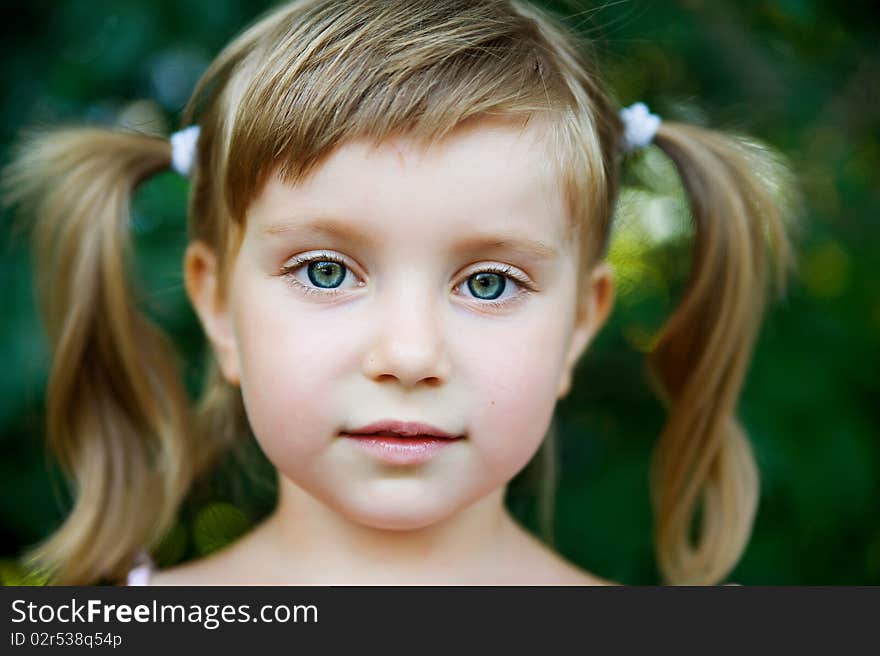 Portrait of a happy liitle girl close-up. Portrait of a happy liitle girl close-up