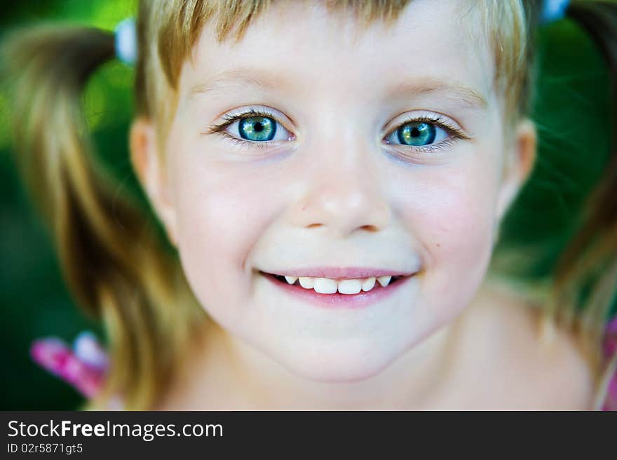 Portrait of a happy liitle girl close-up. Portrait of a happy liitle girl close-up