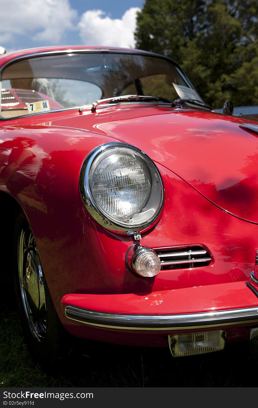 Classic red vintage car with chrome viewed from the front. Classic red vintage car with chrome viewed from the front