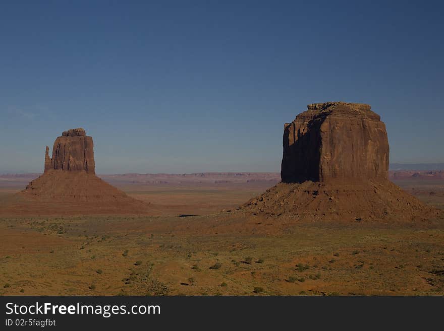 Desert Sand And Rock Formations At Monument Valley In The Navajo Tribal Park, Northeastern Arizona, USA