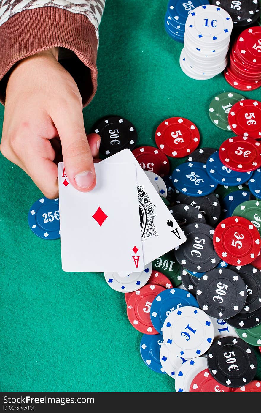 Player shows Two ace cards hand and chips. Player shows Two ace cards hand and chips