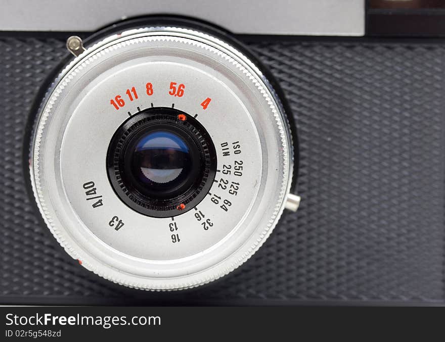 Close-up of an old 35mm film camera lens. Close-up of an old 35mm film camera lens.