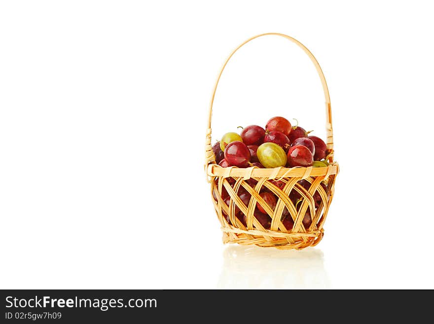 Gooseberries in the basket against white background