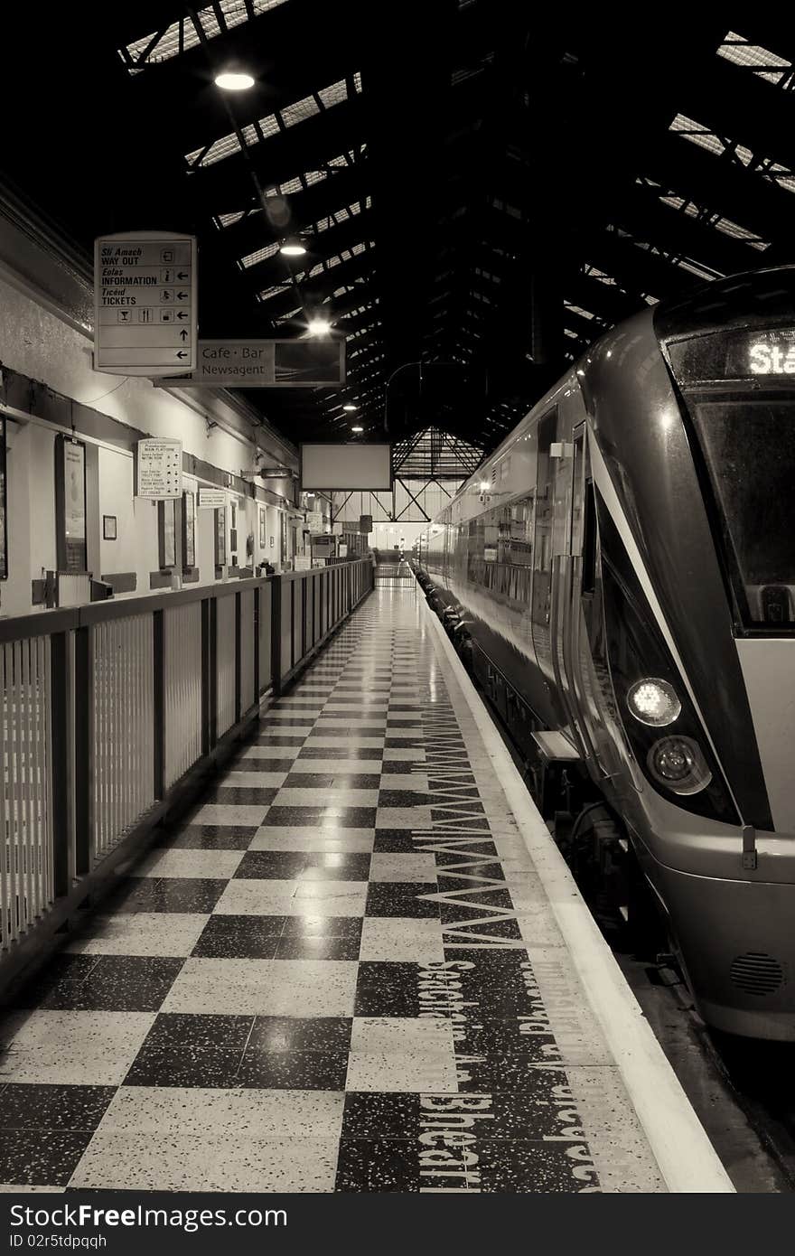 Passenger train inside the station, monochromatic