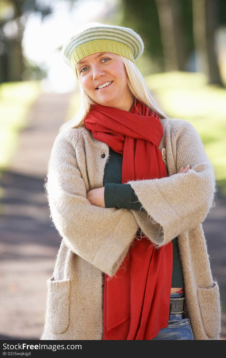 Portrait Of Woman Outdoors In Autumn Landscape