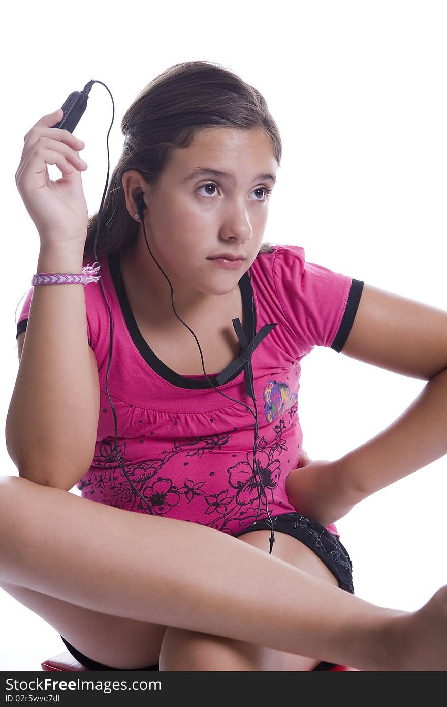 Girl listen to music on the headphones