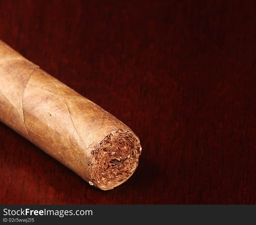 Front focus on an unlit cigar with copy space