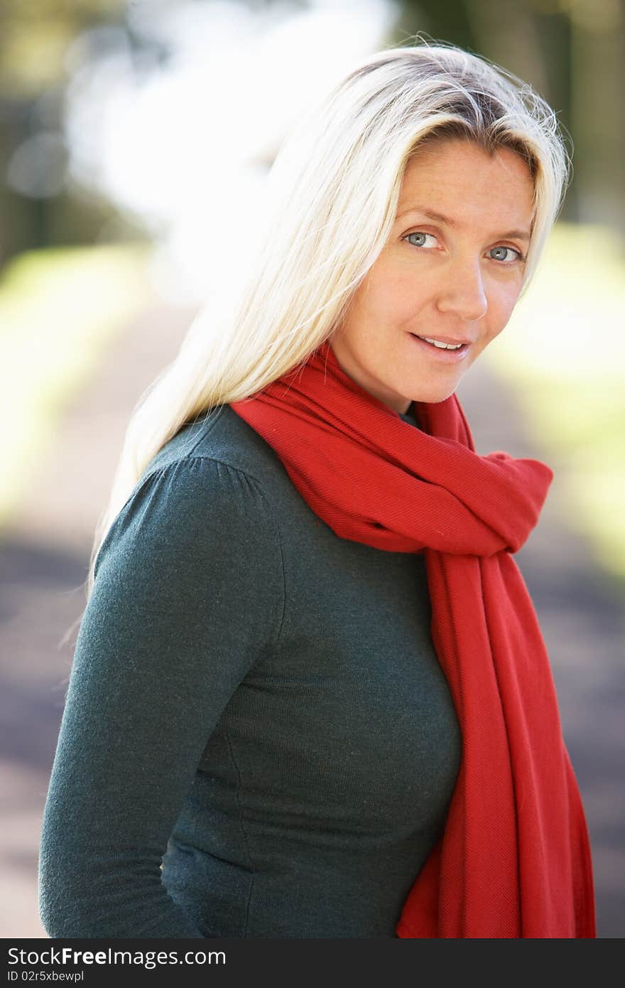 Portrait Of Woman Outdoors In Autumn Landscape