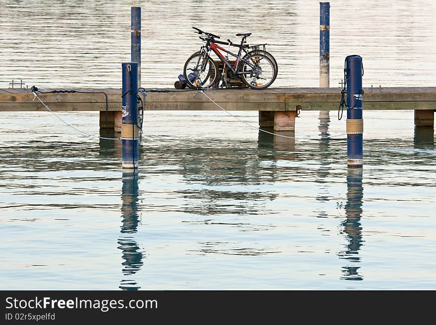 Bicycles are left on the lake bridge. Tranquil scene. Bicycles are left on the lake bridge. Tranquil scene