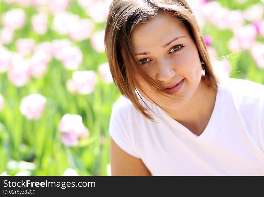 Portrait of beautiful girl with tulip flowers