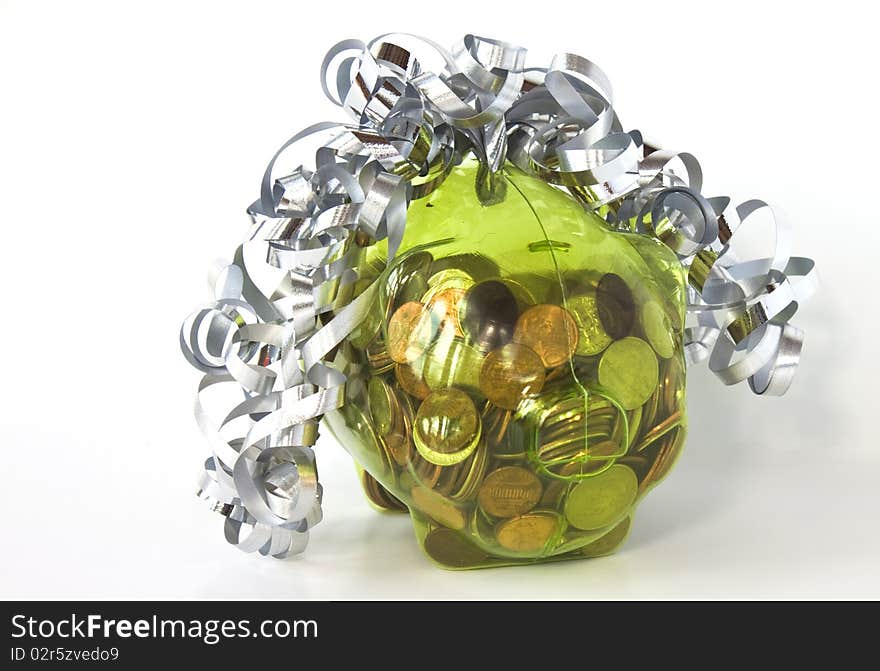 Piggy Bank full of coins with silver ribbon isolated on a white background. Piggy Bank full of coins with silver ribbon isolated on a white background