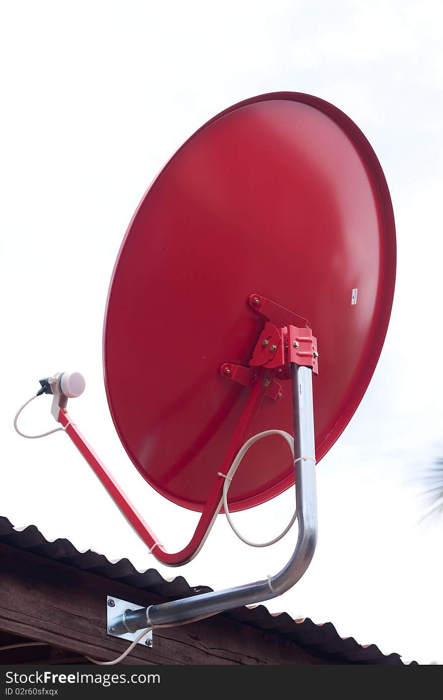 Red satellite dish on the roof