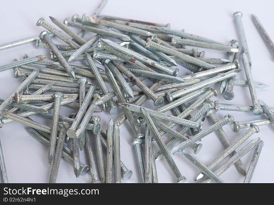 Many nails on white background