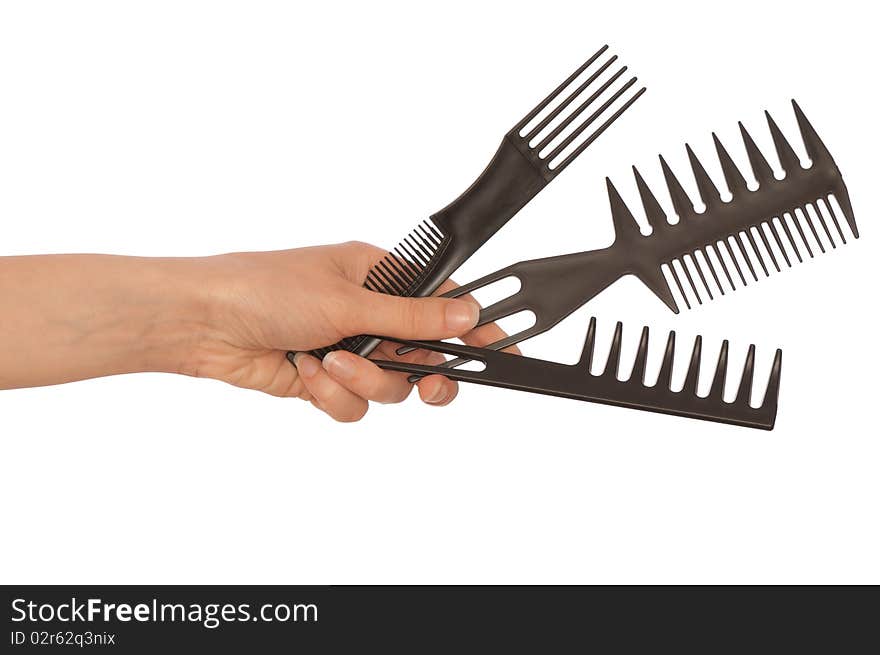 Hairdresser holds the black tools for haircut