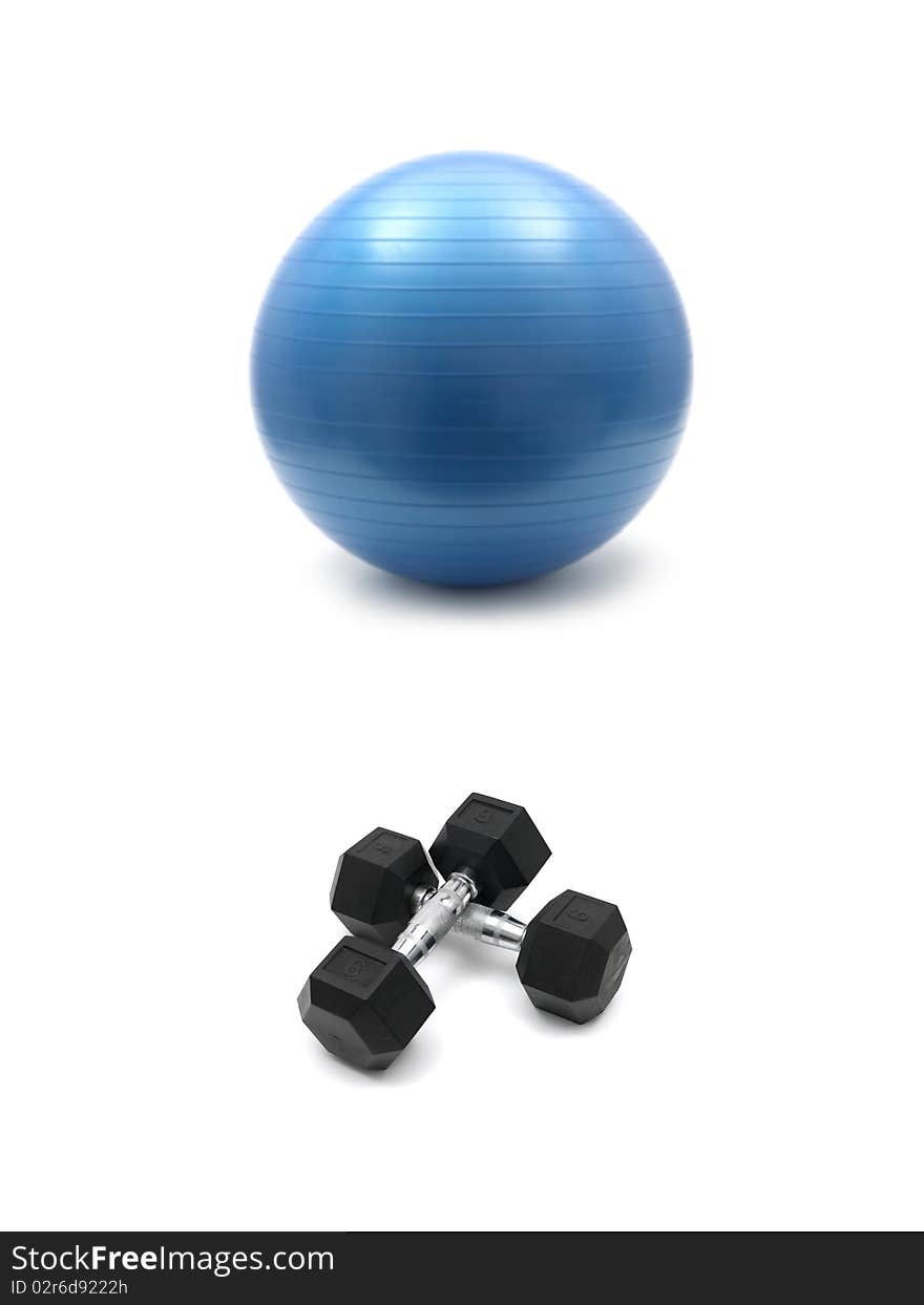 Hand weights and a fitball isolated against a white background. Hand weights and a fitball isolated against a white background