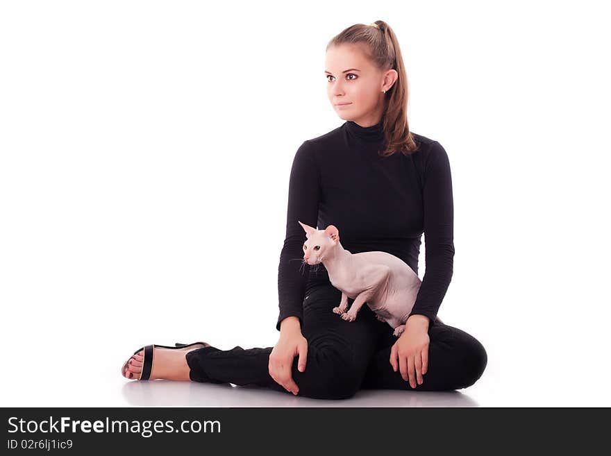 Beautiful young woman with a cat on a white background