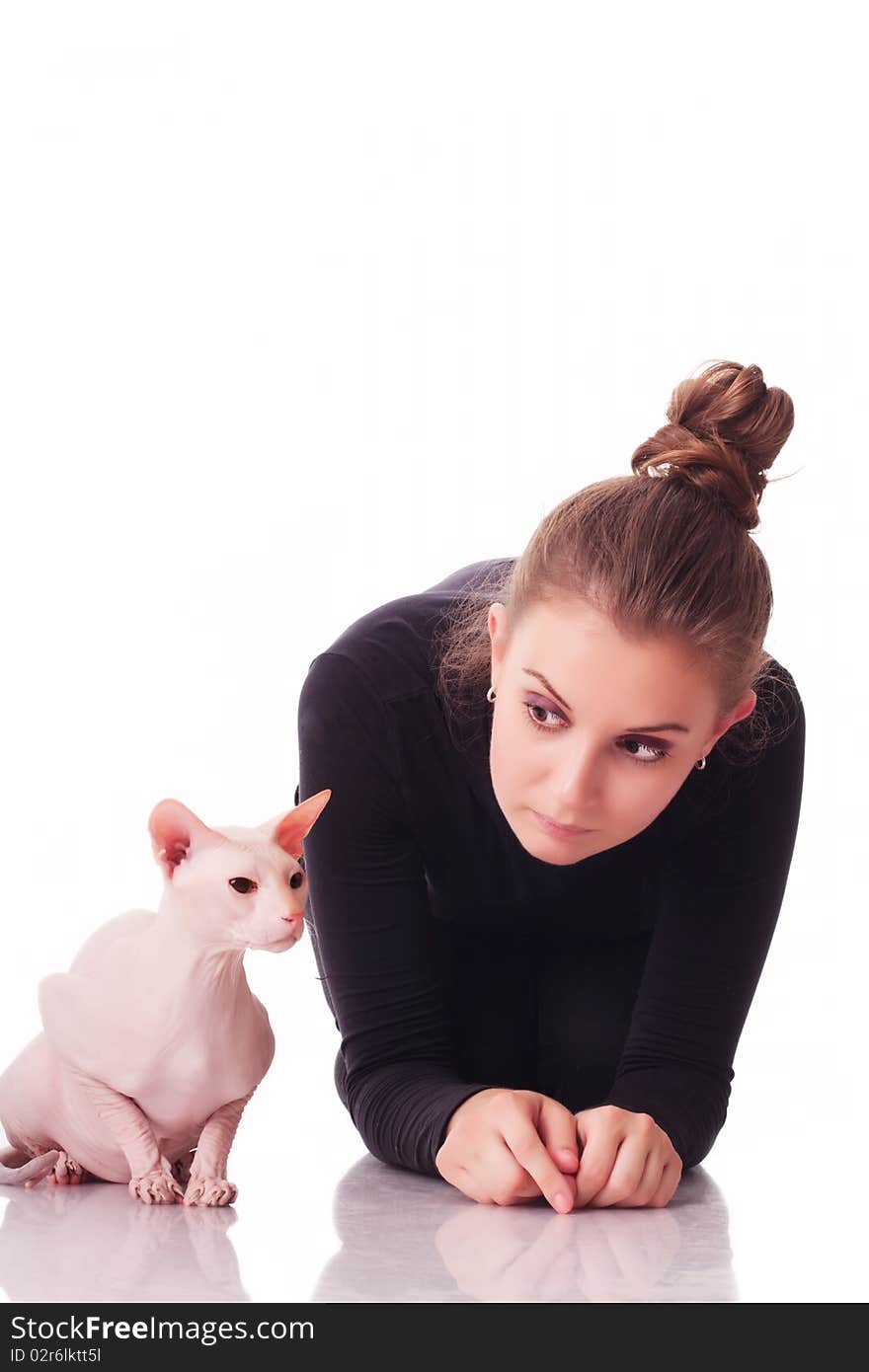 Beautiful young woman with a cat on a white background