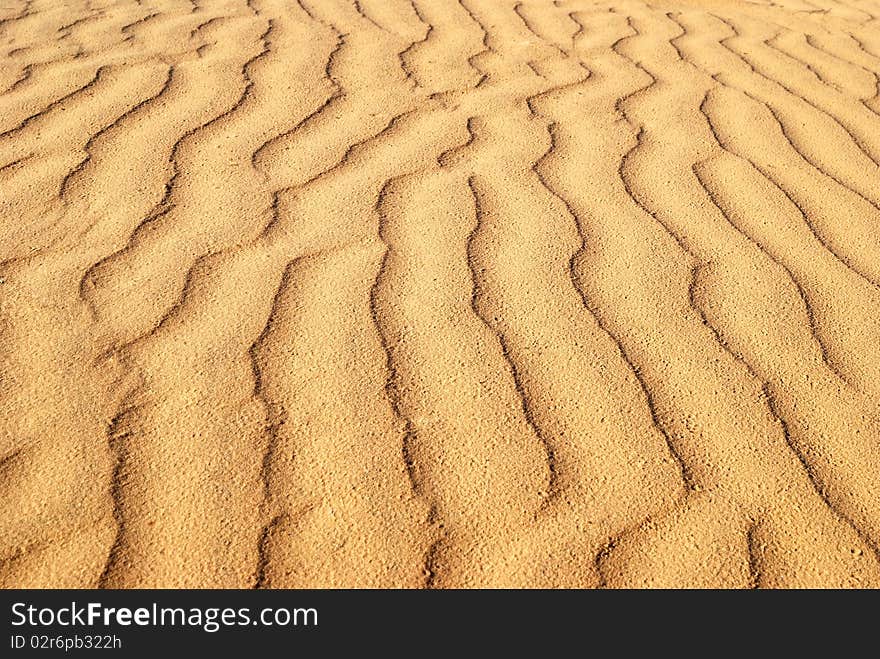 Wavelike ripples of sand, can use for background. Wavelike ripples of sand, can use for background.