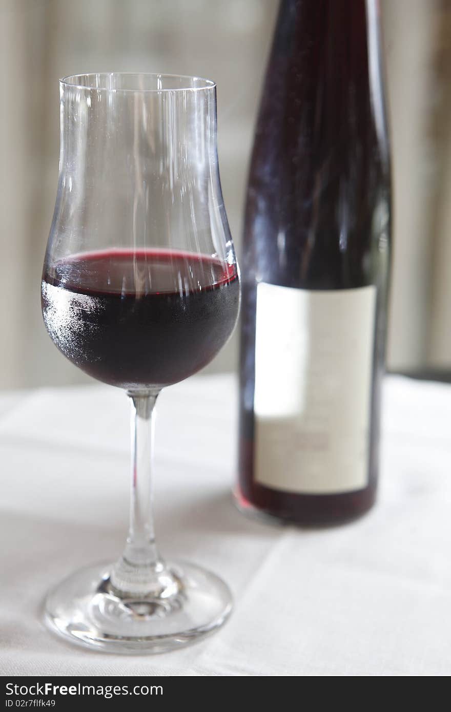 Still life of wine with bottles in background. Shallow field of depth. Still life of wine with bottles in background. Shallow field of depth.