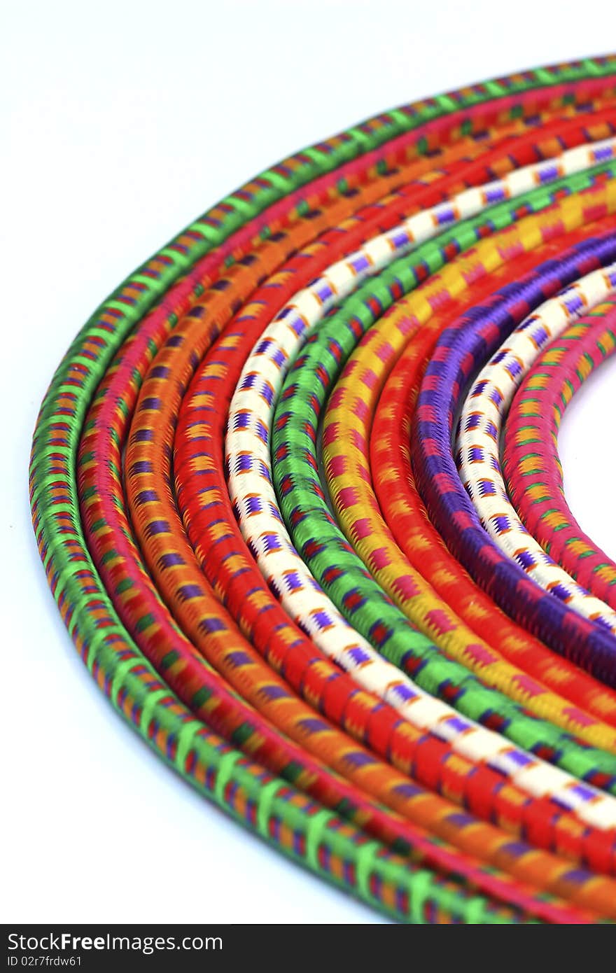 Multi-colored old used rock climbing ropes in bundles. Multi-colored old used rock climbing ropes in bundles