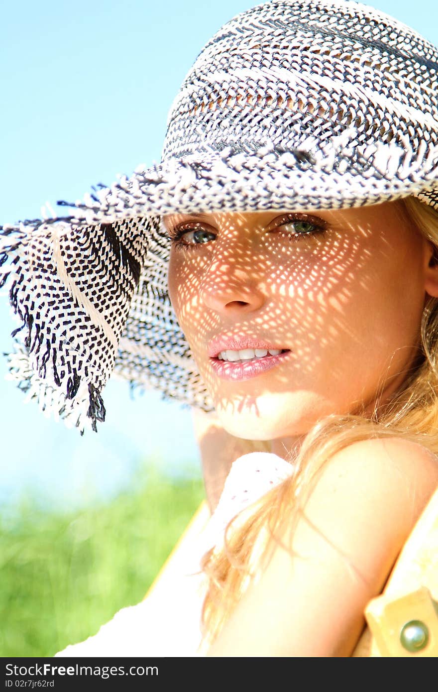 Blond Girl with a sunhat